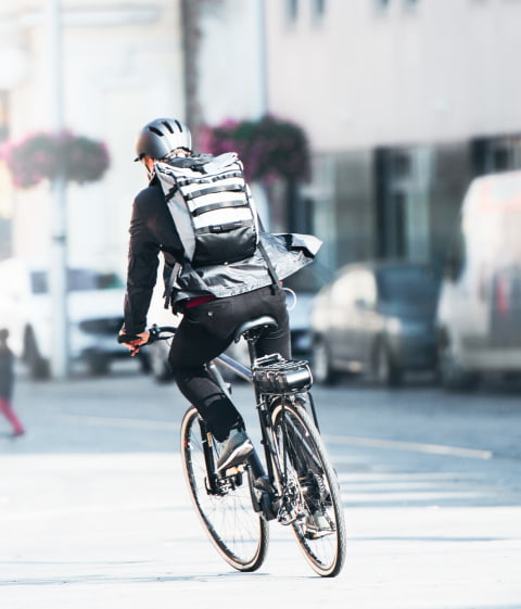 Man on a bicycle delivering an order